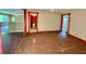 Living room with red trim, access to other rooms and a bathroom at 3682 Jack Pine Ln, Ormond Beach, FL 32174