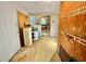 Mud room featuring a water heater and access to the kitchen at 3682 Jack Pine Ln, Ormond Beach, FL 32174