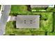 Aerial view of the home's roof, driveway, and surrounding landscaping, showing well-maintained yard at 3940 Se 5Th Ave, Ocala, FL 34480