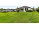 Expansive backyard featuring a pristine lawn and a fence, perfect for outdoor activities at 3940 Se 5Th Ave, Ocala, FL 34480