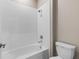 Bathroom featuring modern subway tiles in shower, toilet, and shower head at 3940 Se 5Th Ave, Ocala, FL 34480