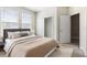 Comfortable bedroom featuring a plush bed, ample natural light, and a closet at 3940 Se 5Th Ave, Ocala, FL 34480