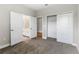 Bedroom with plush carpeting, a walk in closet, and door leading into bathroom at 3940 Se 5Th Ave, Ocala, FL 34480