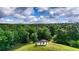 Aerial view of a community gazebo atop a lush, grassy hill surrounded by mature trees at 3940 Se 5Th Ave, Ocala, FL 34480