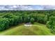 Aerial view of a community gazebo atop a lush, grassy hill surrounded by mature trees at 3940 Se 5Th Ave, Ocala, FL 34480