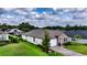 Lovely single-story home featuring a brick facade, a well-manicured lawn, and an attached two-car garage at 3940 Se 5Th Ave, Ocala, FL 34480