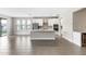 Spacious living room features an open floor plan with a large island and modern kitchen at 3940 Se 5Th Ave, Ocala, FL 34480