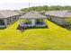 Expansive backyard featuring a covered patio, lush green grass, and picturesque landscaping for outdoor enjoyment at 1192 Via Galuppi St, Kissimmee, FL 34759