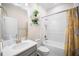 Bathroom featuring white vanity, decorative shelves, and a shower-tub combination at 1192 Via Galuppi St, Kissimmee, FL 34759
