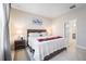 Cozy bedroom with tile flooring, natural light, and a decorative bedside table at 1192 Via Galuppi St, Kissimmee, FL 34759