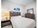 Comfortable bedroom with a neatly made bed and matching modern wood furniture set at 1192 Via Galuppi St, Kissimmee, FL 34759