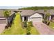 Attractive single-Gathering home with a brick driveway, well-manicured lawn, and beautiful landscaping at 1192 Via Galuppi St, Kissimmee, FL 34759