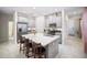 Modern kitchen with stainless steel appliances, a large kitchen island, and elegant countertops at 1192 Via Galuppi St, Kissimmee, FL 34759