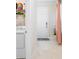 A view of the laundry machines and supplies with a door leading to the outside at 1192 Via Galuppi St, Kissimmee, FL 34759