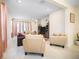 Spacious living room featuring tile flooring, recessed lighting, and comfortable seating arrangement at 1192 Via Galuppi St, Kissimmee, FL 34759