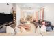 Well-lit living room with an open layout connecting to the kitchen and dining area, perfect for entertaining at 1192 Via Galuppi St, Kissimmee, FL 34759