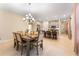 Open concept layout seamlessly connects the dining room, kitchen, and bar stool seating at 1192 Via Galuppi St, Kissimmee, FL 34759