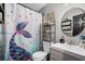 Charming bathroom featuring a mermaid-themed shower curtain and stylish decor at 24 Sapphire Way, Ocala, FL 34472