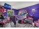 Whimsical bedroom with purple walls, fun decor, and a unique loft bed at 24 Sapphire Way, Ocala, FL 34472