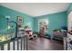 Bright and inviting bedroom with a crib, toys, and ample natural light at 24 Sapphire Way, Ocala, FL 34472