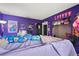 Vibrant bedroom showcasing a lofted bed, colorful decor, and personalized touches at 24 Sapphire Way, Ocala, FL 34472