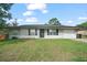 Inviting single-story home with a neatly maintained lawn and classic exterior design at 24 Sapphire Way, Ocala, FL 34472