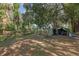 View of backyard with an equipment storage area at 5881 Avenue H, Mc Intosh, FL 32664