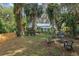 Spacious backyard featuring fire pit and seating, perfect for outdoor enjoyment at 5881 Avenue H, Mc Intosh, FL 32664
