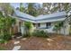 Backyard with mature landscaping, and a trellis at 5881 Avenue H, Mc Intosh, FL 32664