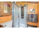 Unique bathroom with a corner shower, wooden accents, and colorful walls at 5881 Avenue H, Mc Intosh, FL 32664
