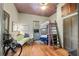 Cozy bedroom with a lofted bed and wood floors at 5881 Avenue H, Mc Intosh, FL 32664
