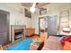 Bright bedroom features wood floors, vintage fireplace and colorful, homey charm at 5881 Avenue H, Mc Intosh, FL 32664