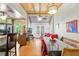 Bright dining room with unique ceiling, hardwood floors and modern table at 5881 Avenue H, Mc Intosh, FL 32664