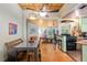 Open floor plan featuring kitchen, dining area and living space with hardwood floors at 5881 Avenue H, Mc Intosh, FL 32664