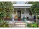 Inviting front porch with seating and decor, offering a relaxing outdoor space at 5881 Avenue H, Mc Intosh, FL 32664