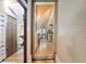 Hallway view showcases access to the bathroom and an opening into another room at 5881 Avenue H, Mc Intosh, FL 32664