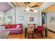 Living room featuring light filled room, cozy seating, and hardwood floors at 5881 Avenue H, Mc Intosh, FL 32664