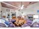 Spacious living room showcases a fireplace, hardwood floors, and comfortable seating at 5881 Avenue H, Mc Intosh, FL 32664