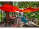Spacious outdoor deck with dining and lounge areas, perfect for entertaining in a lush setting at 5881 Avenue H, Mc Intosh, FL 32664