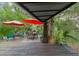 Outdoor patio with dining area and lounge chairs, overlooking lush greenery at 5881 Avenue H, Mc Intosh, FL 32664