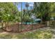 Private fenced pool with outdoor seating, creating a perfect backyard retreat at 5881 Avenue H, Mc Intosh, FL 32664