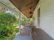 Relaxing side porch with ample space, great for enjoying the outdoors at 5881 Avenue H, Mc Intosh, FL 32664