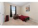 This cozy bedroom features a twin bed and a window dressed with black curtains, offering a comfortable private space at 8123 Sw 57Th Ct, Ocala, FL 34476
