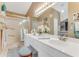 Bathroom featuring a double vanity with white countertops and ample lighting, with a shower on the left at 916 Ashmeade Ct, Port Orange, FL 32127
