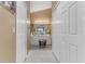 Well-lit bathroom features a double sink vanity, neutral tile, and ample storage with multiple closets at 916 Ashmeade Ct, Port Orange, FL 32127