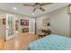 Comfortable bedroom with a writing desk, with french doors leading to the hallway and kitchen, and soft, natural lighting at 916 Ashmeade Ct, Port Orange, FL 32127