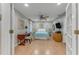 Bright bedroom with a ceiling fan, light walls, and wooden floors at 916 Ashmeade Ct, Port Orange, FL 32127