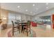 Open dining area with vaulted ceilings, modern lighting, and views into the living room at 916 Ashmeade Ct, Port Orange, FL 32127