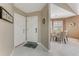 Welcoming entryway with white doors and tile flooring leading to a dining area at 916 Ashmeade Ct, Port Orange, FL 32127