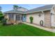 Charming single-story home with well-maintained lawn, brick accents, and a lovely blue front door at 916 Ashmeade Ct, Port Orange, FL 32127